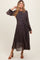 woman wearing a navy floral long sleeve maternity dress with a tie waist and flowing skirt