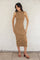 woman wearing a ribbed tan midi dress with side slits and strappy brown heels