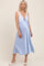 woman wearing a light blue lace and satin maternity nightgown with a tied detail and a visible baby bump
