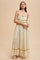 woman wearing a floral maxi dress with spaghetti straps and ruffle details, set against a neutral background