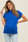 woman wearing a bright blue short sleeve maternity top and showing her baby bump