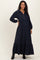 woman wearing a navy blue maternity maxi dress with a collared neckline and button details, showing her baby bump
