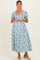 woman wearing a floral print maternity dress with puffed sleeves and a square neckline, featuring a visible baby bump