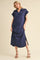 woman wearing a navy blue short sleeve midi dress with a collar and side slits