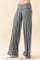 woman wearing gray wide-leg lounge pants with a high waistband and a relaxed fit