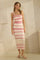 woman wearing a knitted pink and white striped midi dress with a one-shoulder design and ribbed detailing