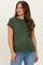 woman wearing a dark green short sleeve maternity top with rolled sleeves and a relaxed fit