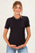 woman wearing a black short sleeve maternity top and holding her baby bump