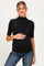 woman wearing a black short sleeve maternity top and holding her baby bump