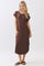 woman wearing a brown short sleeve midi dress and black slide sandals
