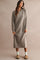 woman wearing a light gray ribbed knit long sleeve sweatshirt dress with a quarter zip and side slits