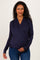 woman wearing a navy blue long sleeve maternity wrap top and holding her baby bump
