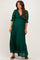 woman wearing a dark green lace maternity maxi dress with ruffled details and three-quarter sleeves, showing baby bump