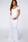 woman wearing a white off-the-shoulder maternity gown with a fitted silhouette and baby bump visible