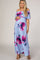 pregnant woman in light blue off the shoulder floral maternity maxi dress with pink and purple flowers