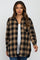 woman wearing a black and tan plaid maternity shirt with a white tank top underneath and a visible baby bump