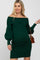 woman wearing a dark green off-the-shoulder maternity dress with puff sleeves and holding a small handbag, visible baby bump