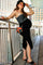 woman wearing a grey maternity tank top and a black midi skirt, showing her baby bump and standing by a railing