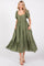 woman wearing a green puff sleeve maxi dress with a tie front and side pockets