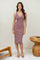 woman wearing a dusty rose ribbed midi dress with buttons and a fitted silhouette