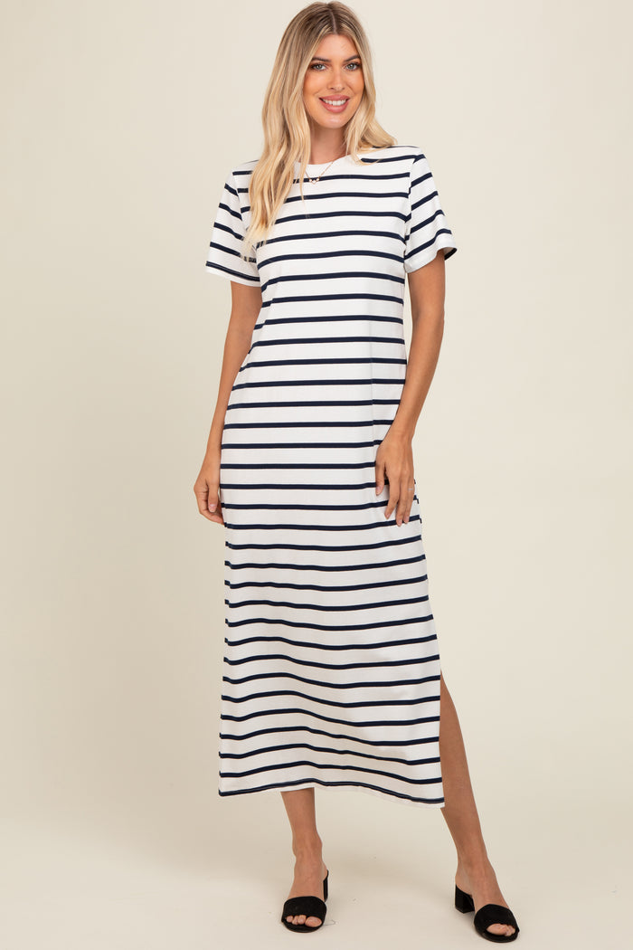 woman wearing a navy and white striped maxi dress with short sleeves and side slits