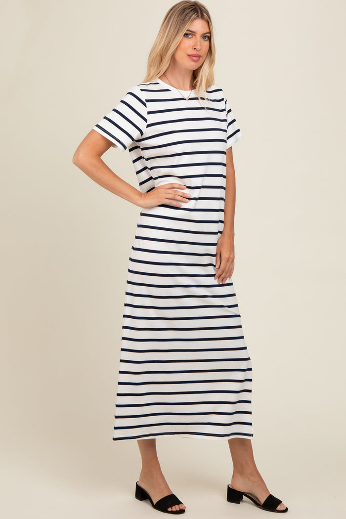 woman wearing a white and navy striped maxi dress with short sleeves and a relaxed fit