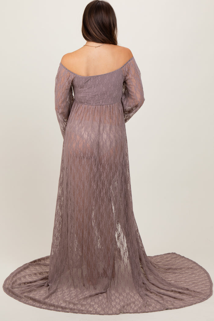 woman wearing a lavender lace off-shoulder maternity gown with long sleeves and a flowing train, showing her baby bump