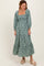 woman wearing a teal floral tiered maxi dress with a square neckline and long sleeves