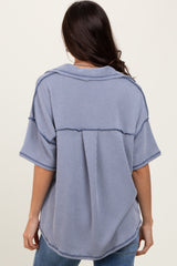 woman wearing a blue and white striped oversized shirt with a relaxed fit and back seam details
