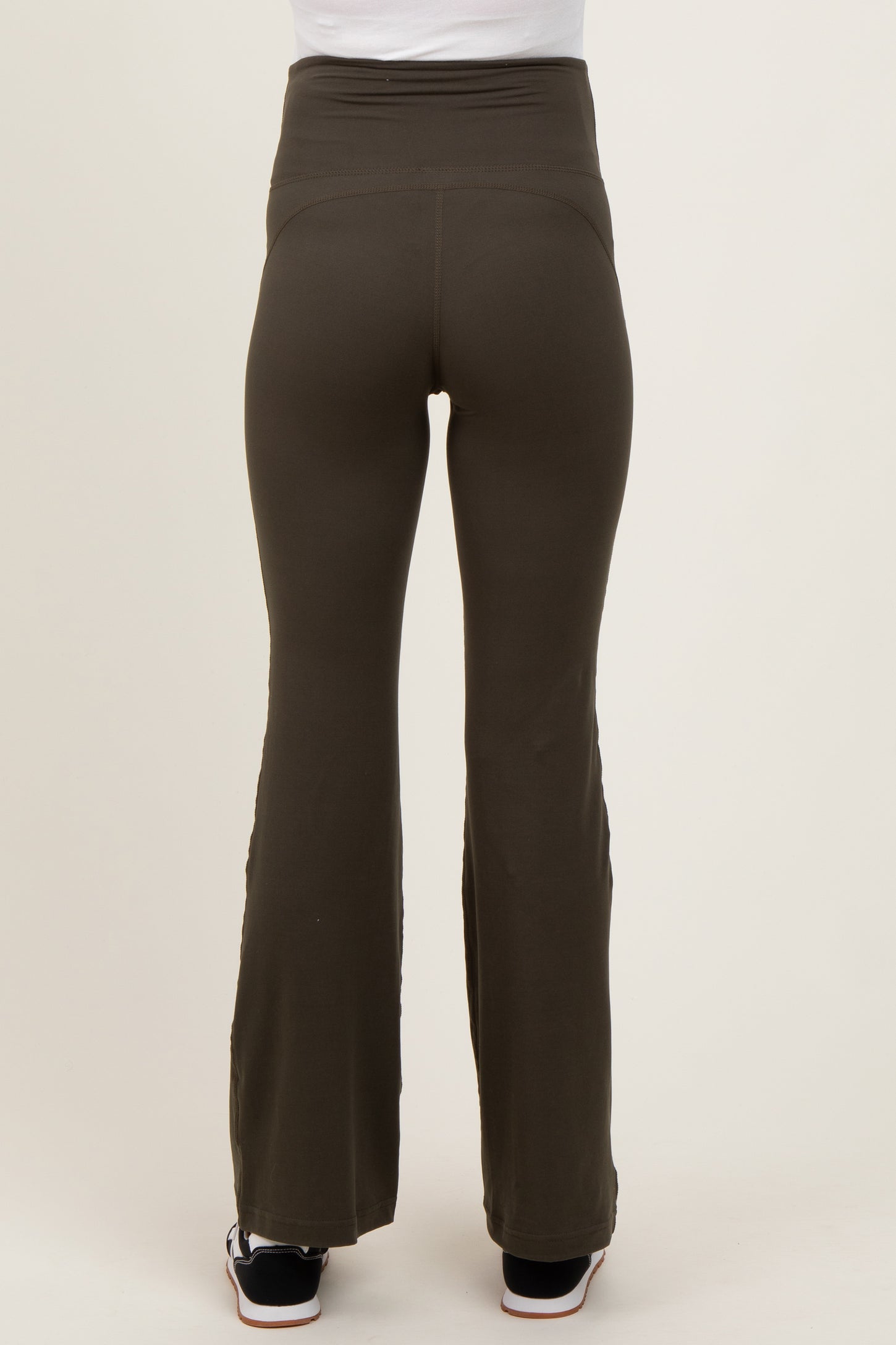 maternity wear olive green flared pants with a high waistband, shown from the back