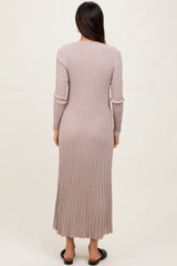 woman wearing a long sleeve ribbed taupe maxi dress, view from the back