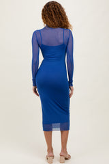 woman wearing a blue long sleeve bodycon dress with sheer mesh details and a midi length, viewed from the back