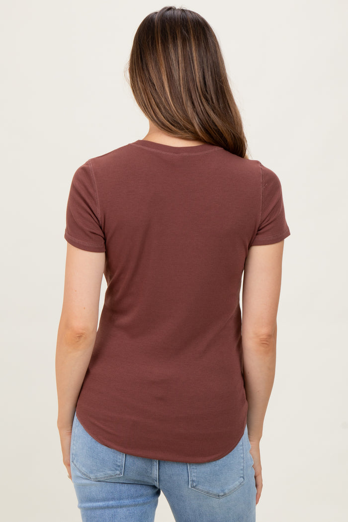 woman wearing a maroon ribbed maternity t-shirt with a curved hem and short sleeves, seen from the back