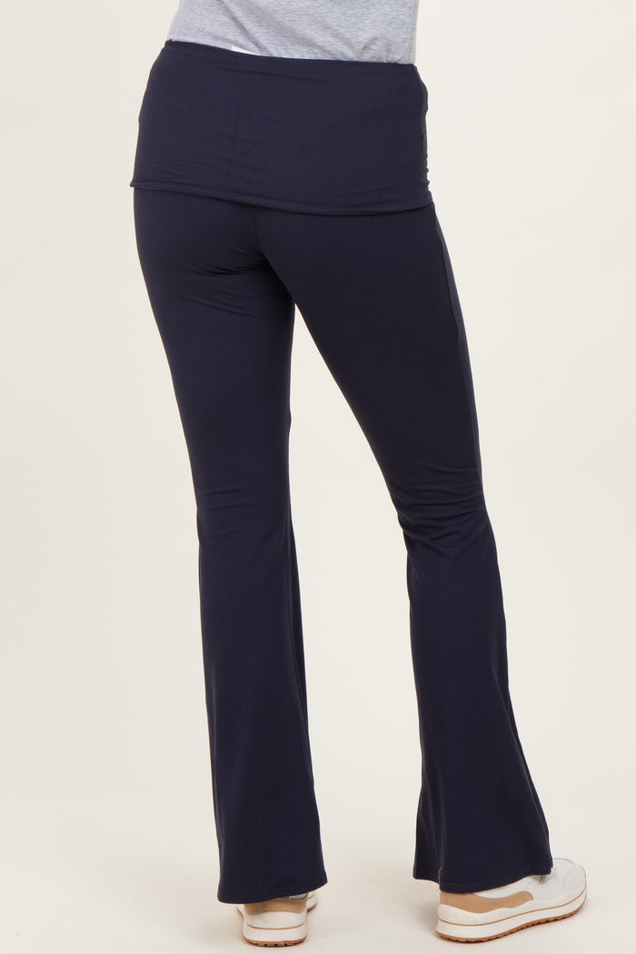 woman wearing navy blue flared lounge pants seen from the back