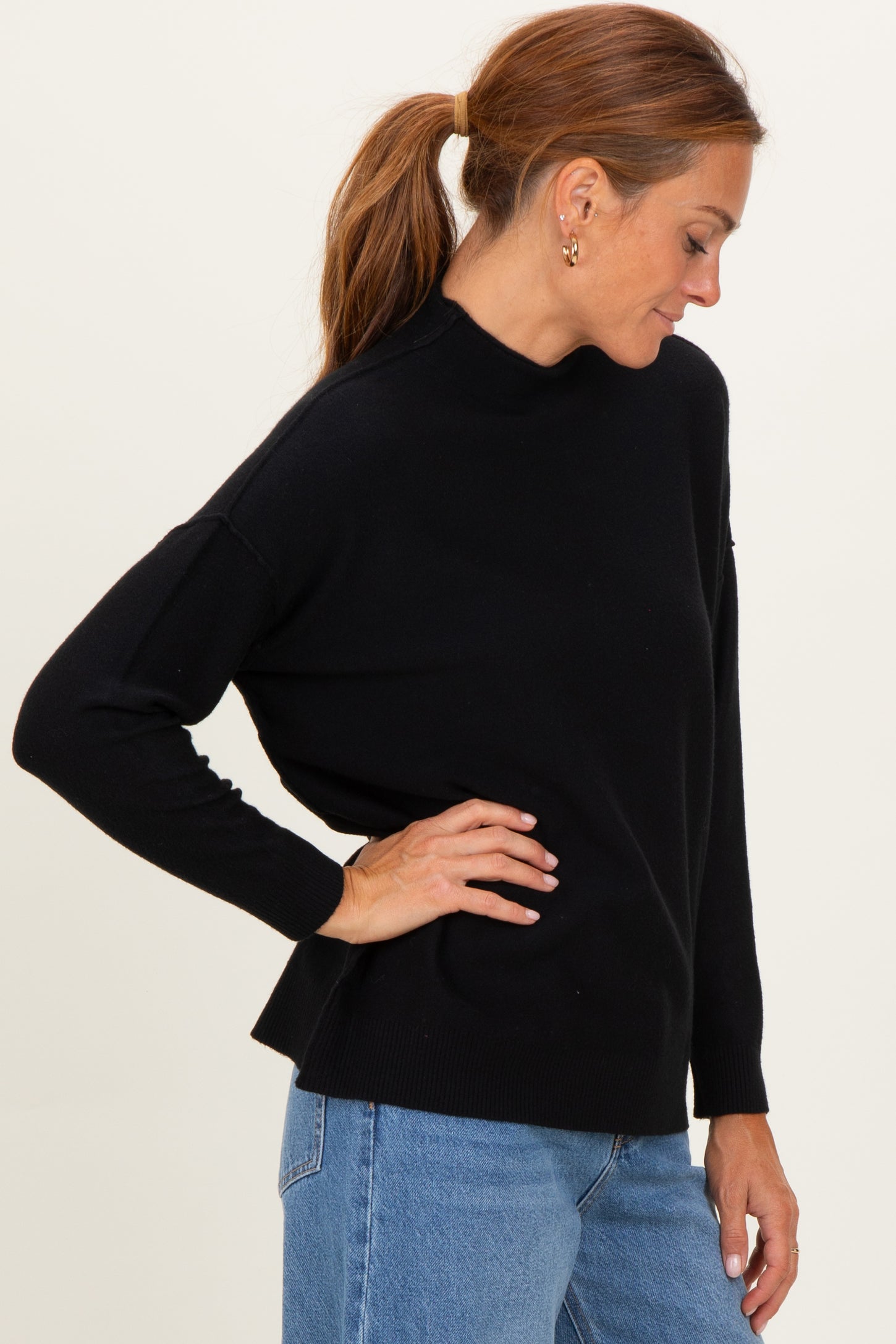 Black Mock Neck Exposed Seam Sweater