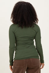 woman wearing a fitted long sleeve olive green ribbed top, seen from the back