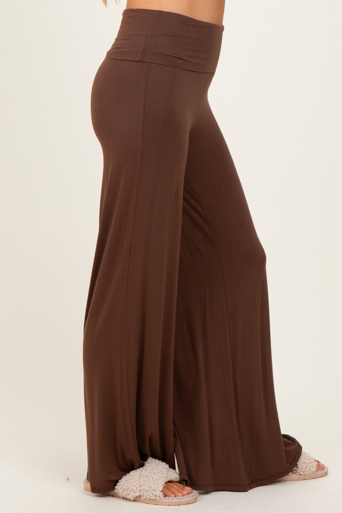 woman wearing brown wide-leg lounge pants with a high waistband and soft texture