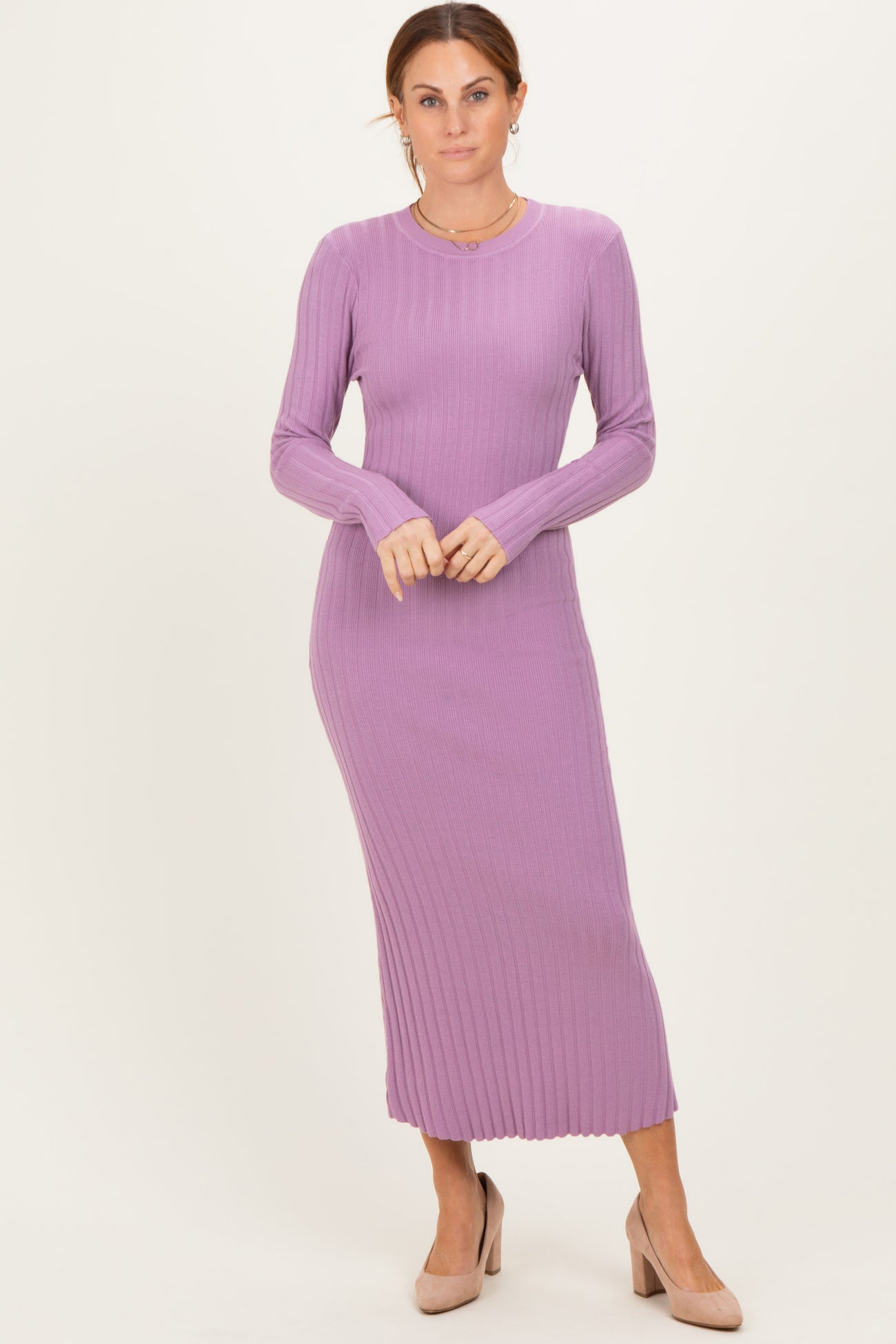 woman wearing a lavender ribbed long sleeve maxi dress and nude heels