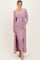 woman wearing a lavender ribbed midi dress with a long cardigan and a fitted silhouette