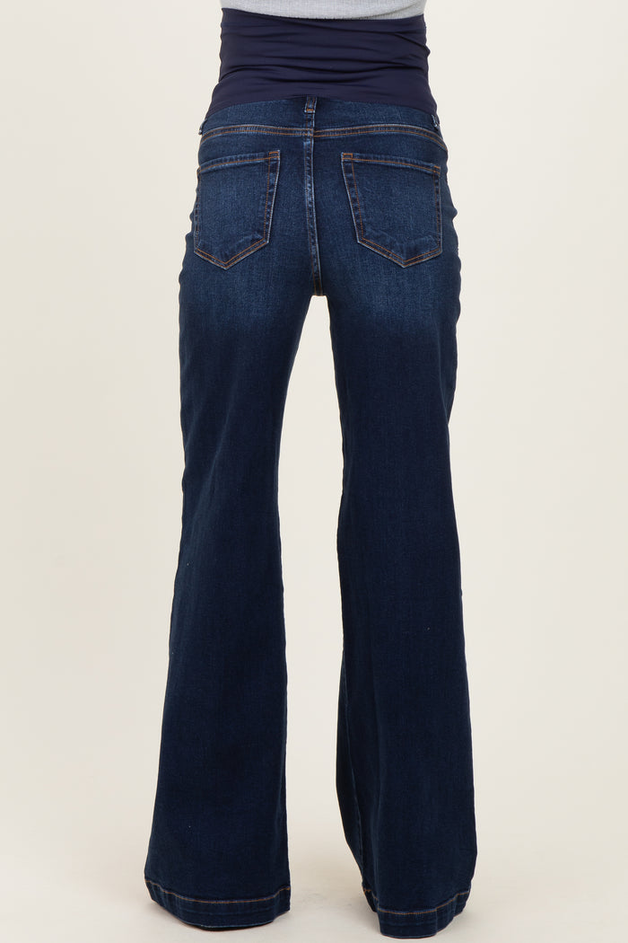 maternity wear dark blue flared jeans with a stretchy waistband, model shown from the back