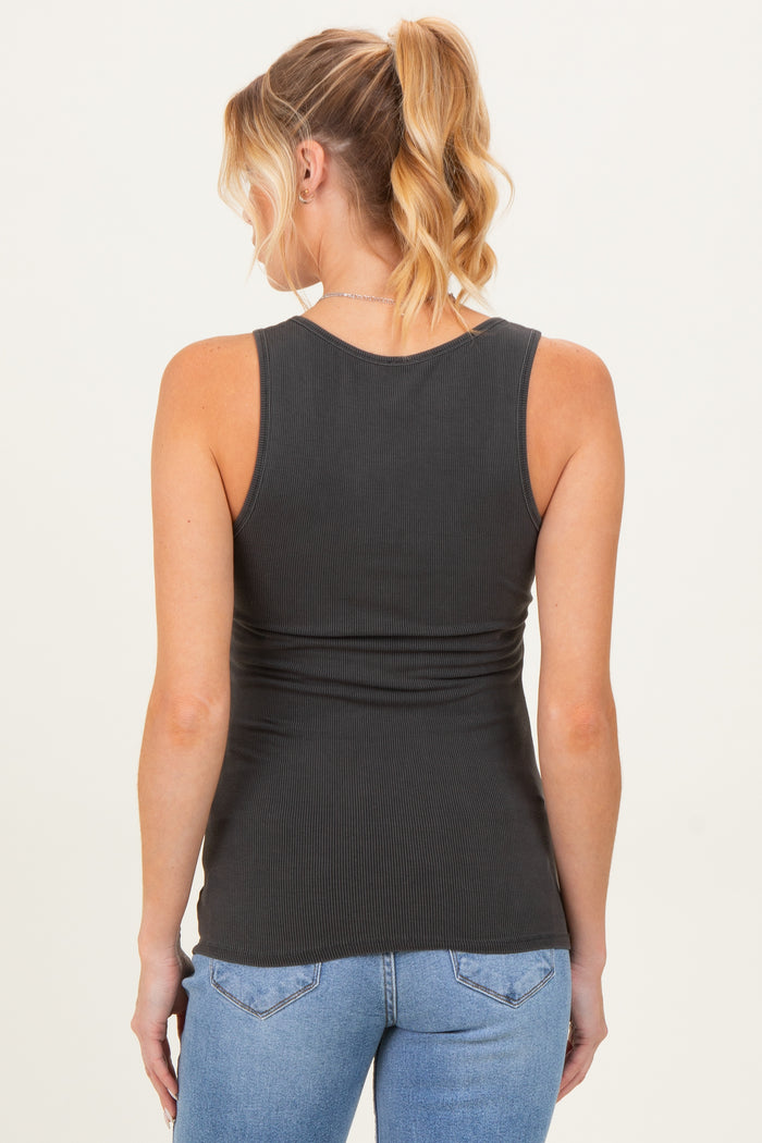 woman wearing a dark gray maternity tank top with a fitted style, showing a smooth back and no visible baby bump