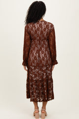 woman wearing a brown lace long sleeve maxi dress with tiered details, showing the back view