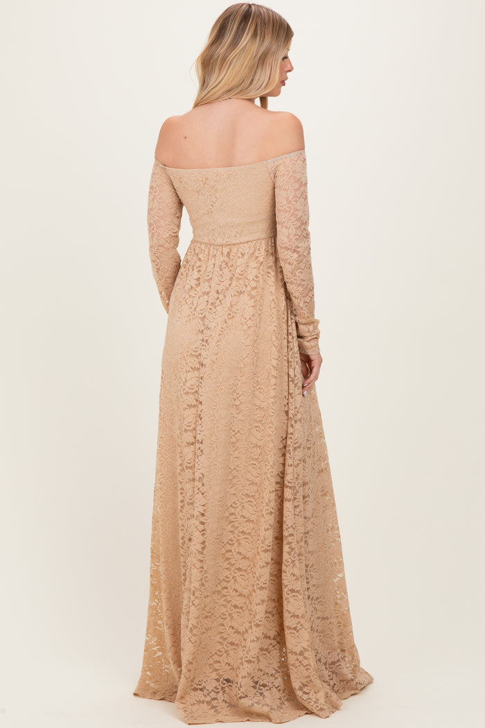 woman wearing a long off-the-shoulder nude lace dress with long sleeves and a flowing skirt from the back