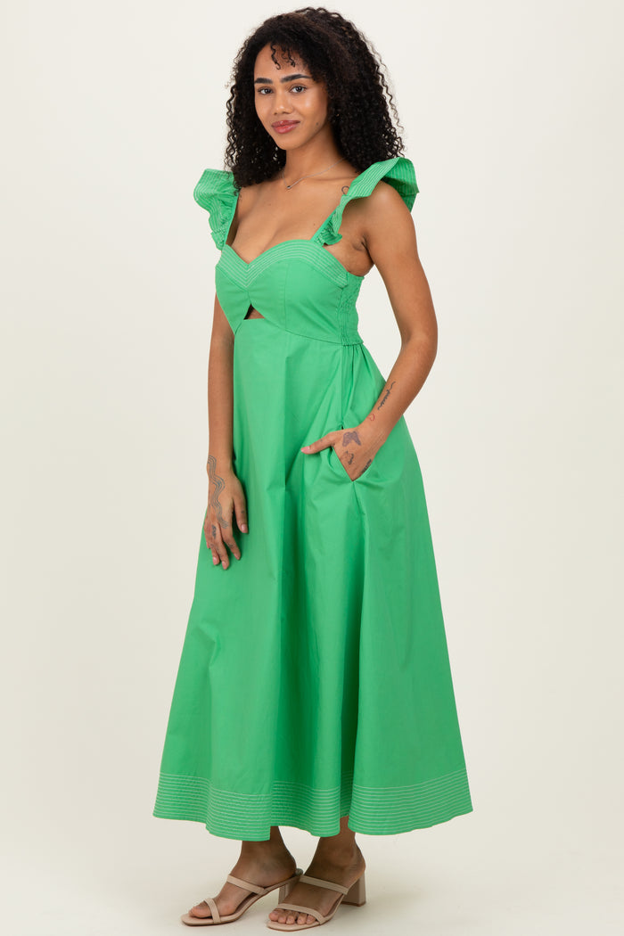 woman wearing a green midi dress with ruffled straps and side pockets