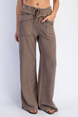 woman wearing taupe wide-leg corduroy pants with front pockets and drawstring waist