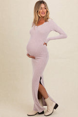 woman wearing a light purple ribbed maternity dress with side slits and a visible baby bump