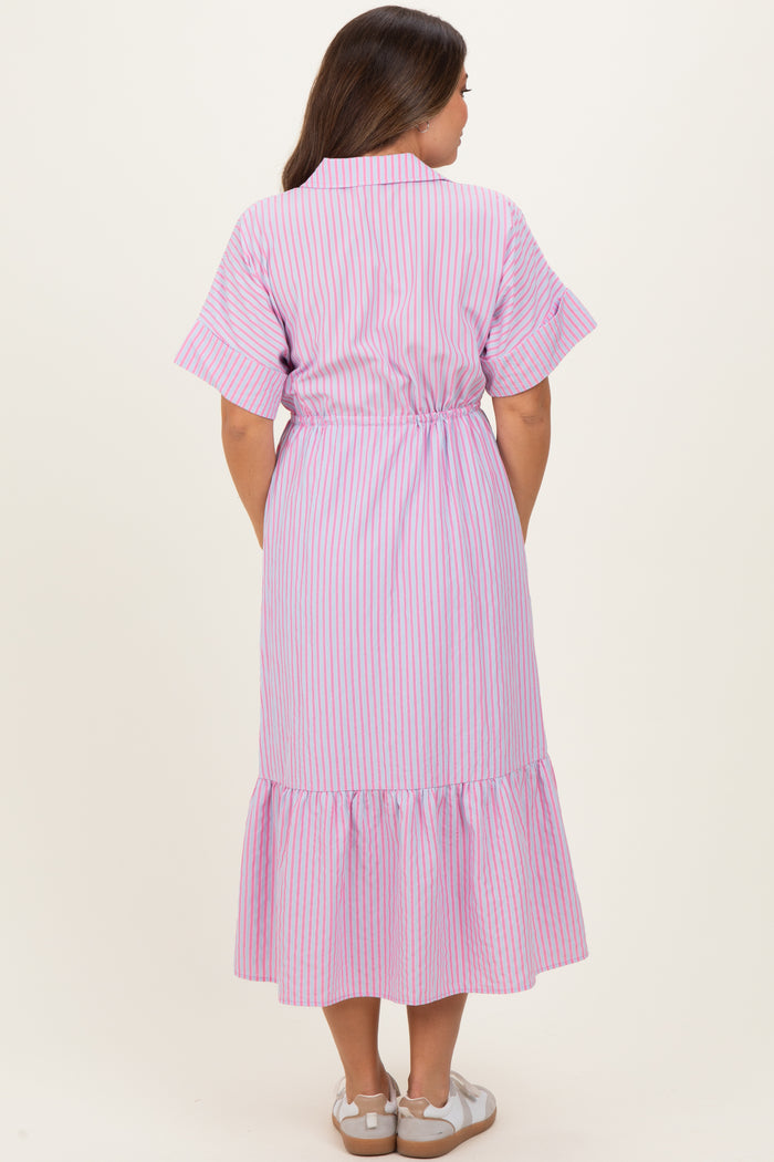 woman wearing a pink and white striped maternity dress with short sleeves and a ruffled hem