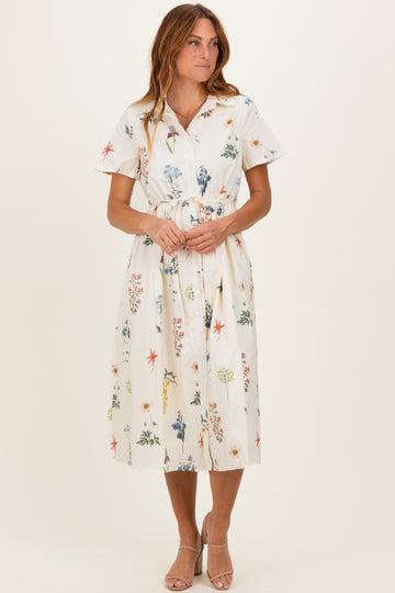 woman wearing a floral midi dress with short sleeves and a tie waist detail