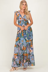 woman wearing a floral print maxi dress with ruffled sleeves and a tiered skirt