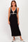 woman wearing a black sleeveless maxi dress with a v-neck and lace trim details